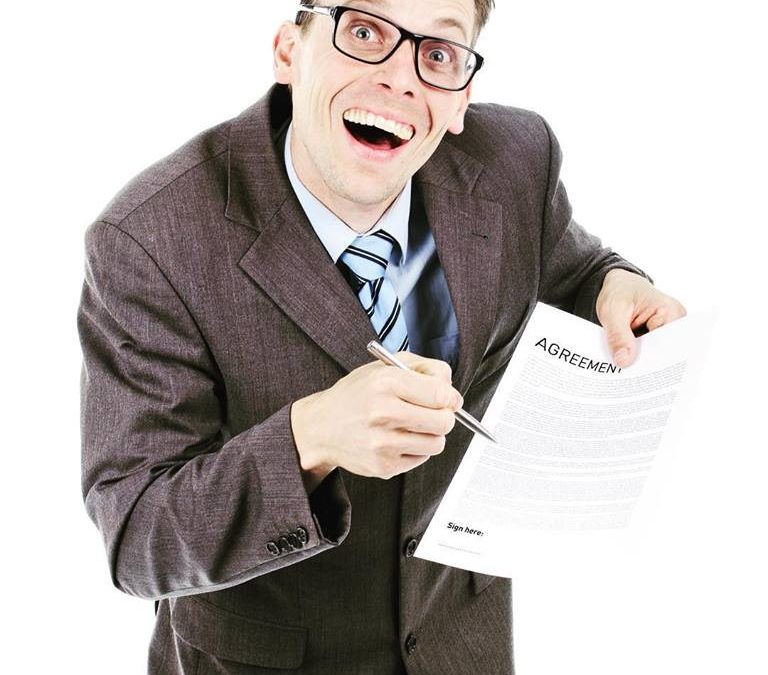 Man Holding Agreement Papers